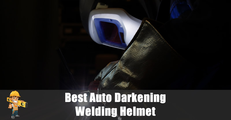 Welder using a auto darkening welding helmet